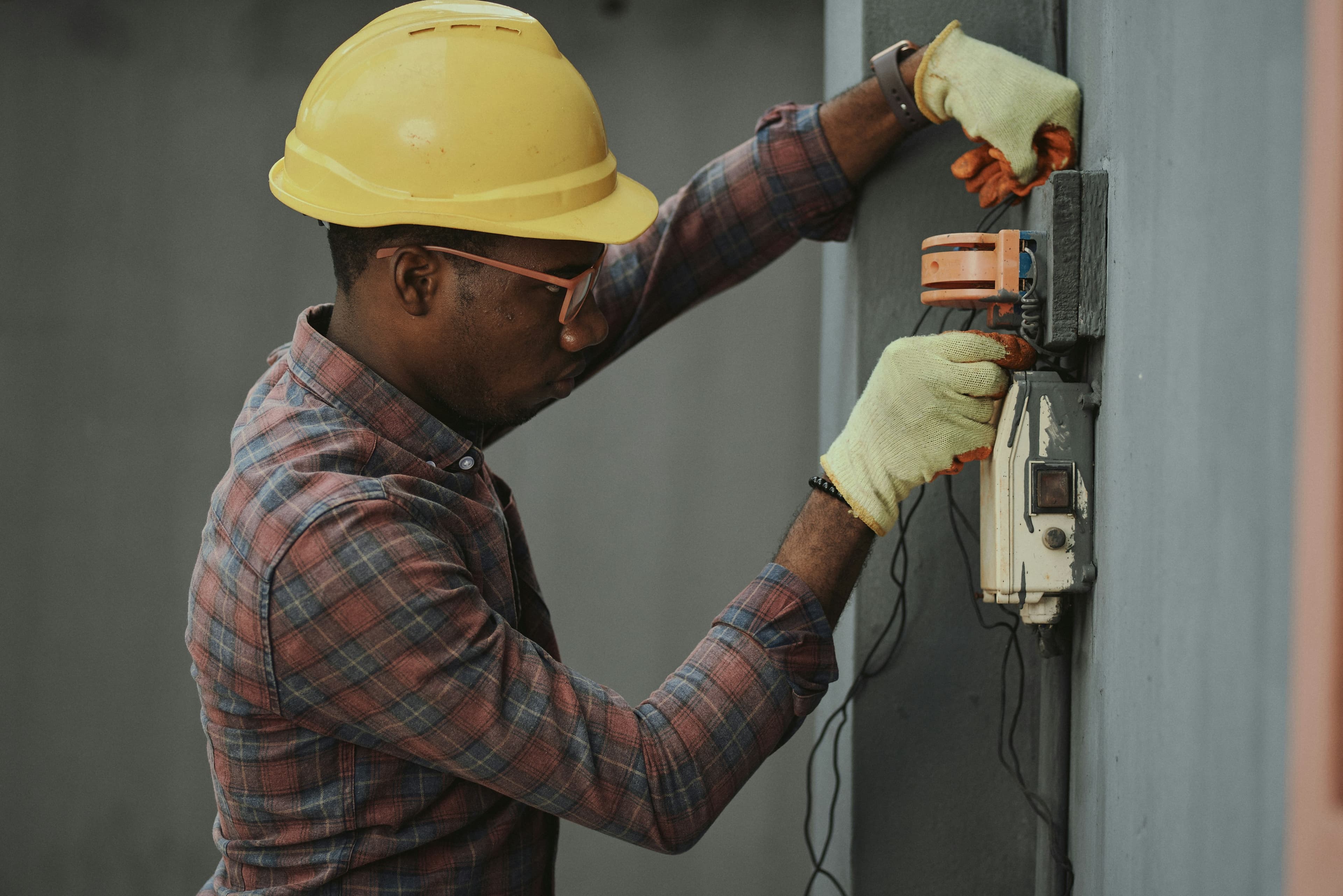 Electrician troubleshooting residential electrical issue